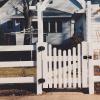 Arbor with gate and 3 rail fence